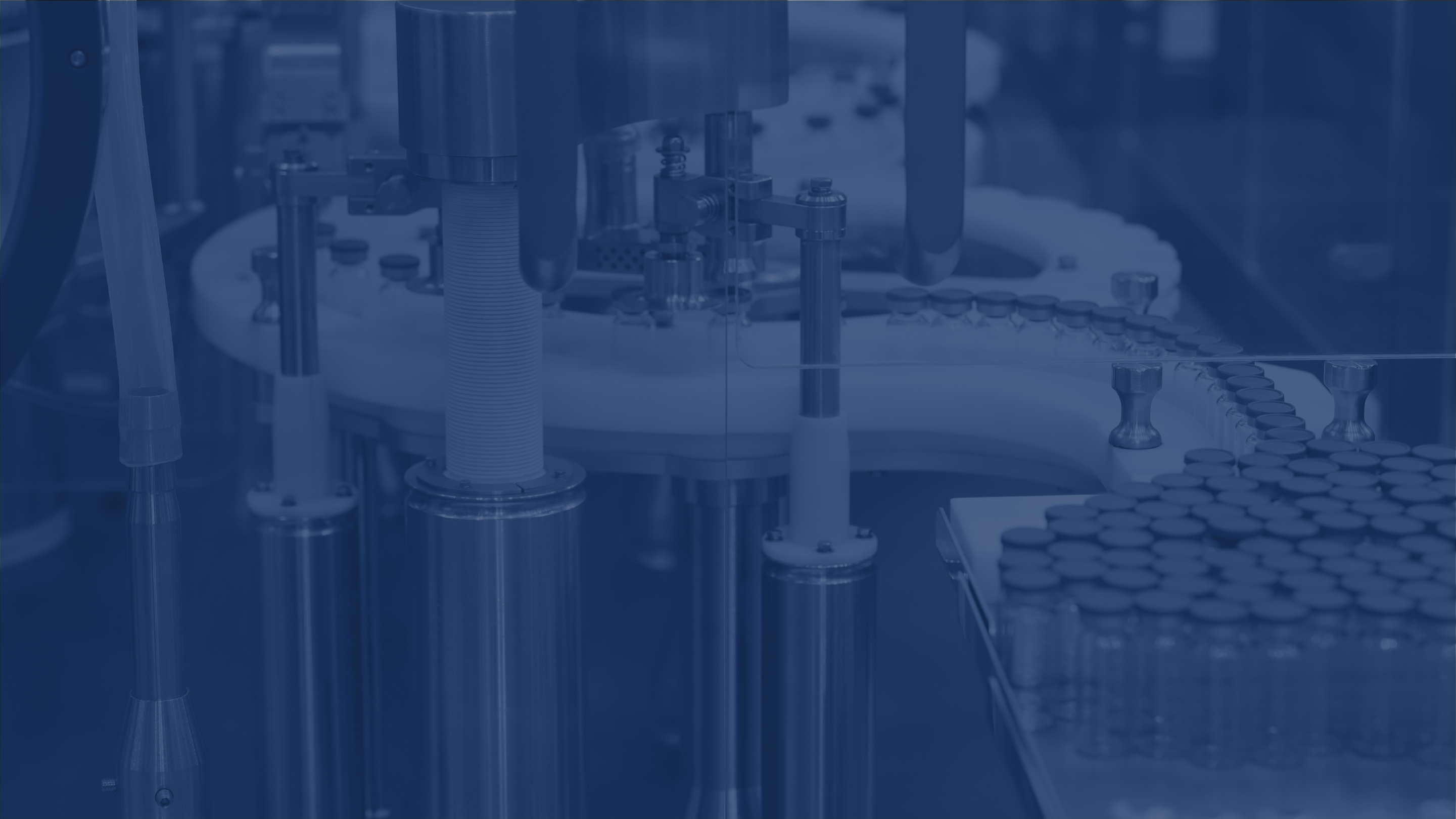 blue filter over photo of vials on conveyer belt