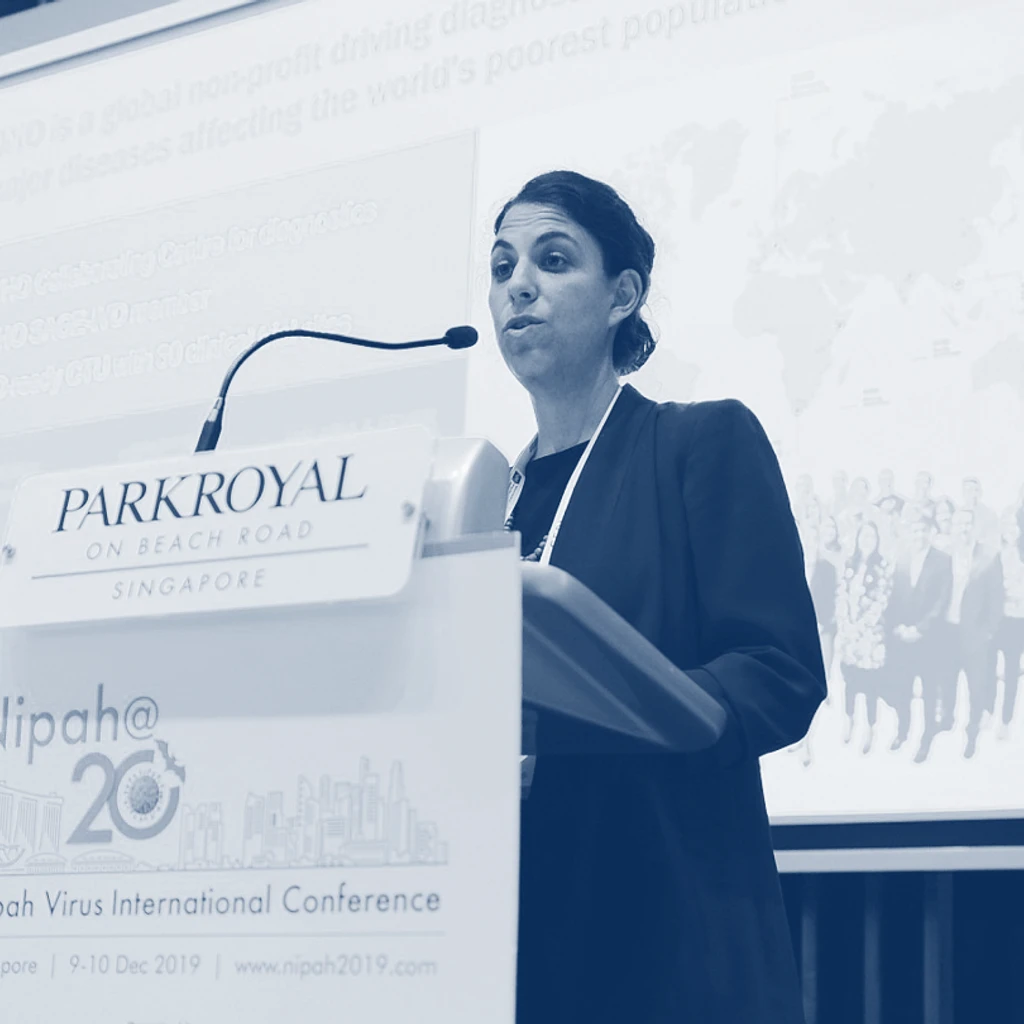 A speaker presenting at the Nipah Virus International Conference in 2019