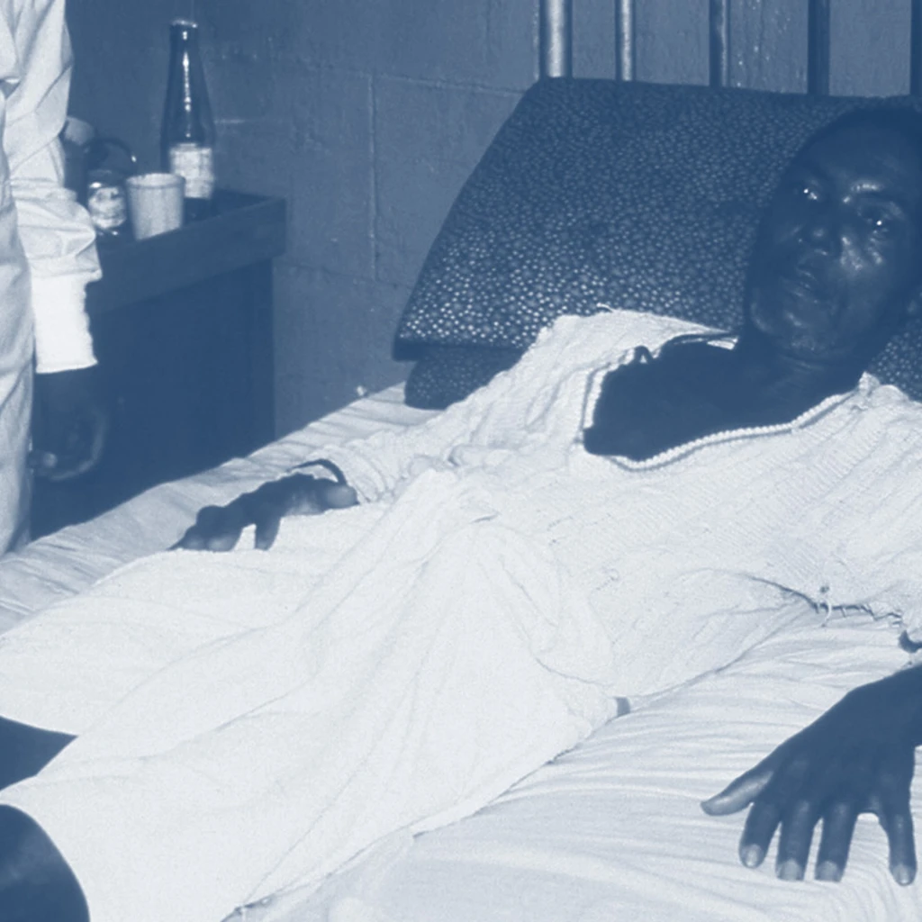 retro photo of patient suffering from lassa fever lying on bed