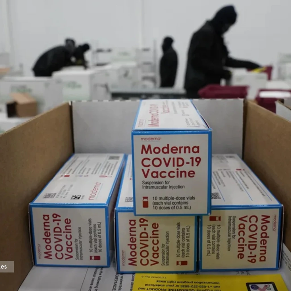 branded stacked boxes of Moderna COVID-19 vaccines being ready for shipment