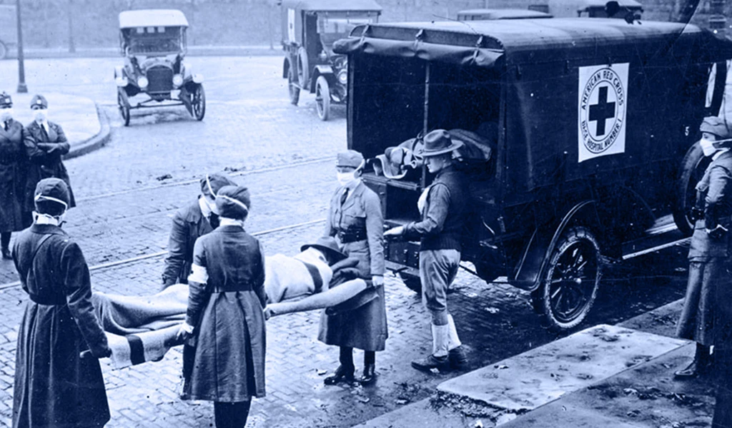historic image of red cross workers putting flu victim into cart