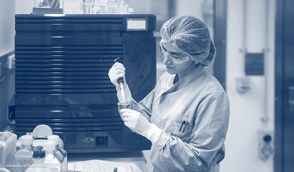 female researcher at University of Queensland holding pipette