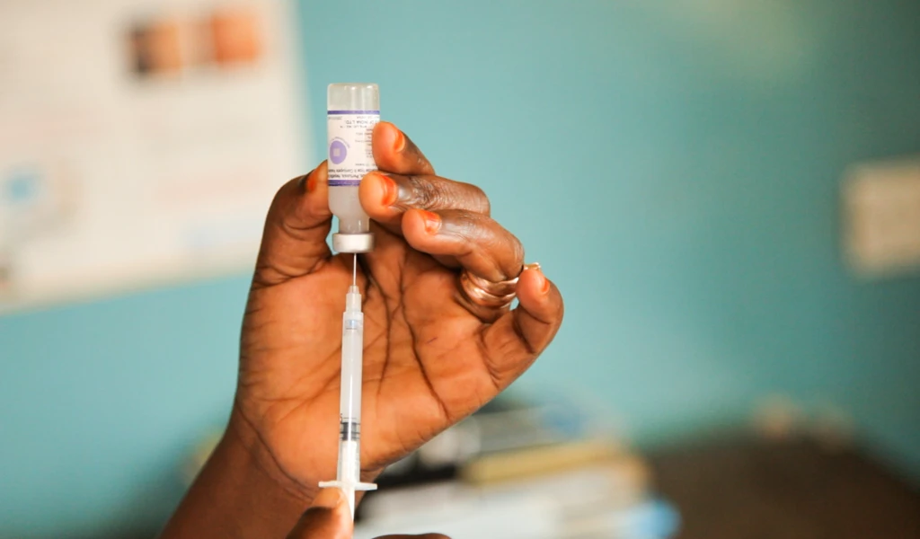 Vaccine vial and syringe