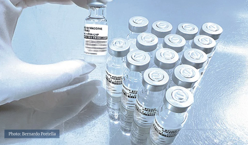 closeup of glass vials on metal surface