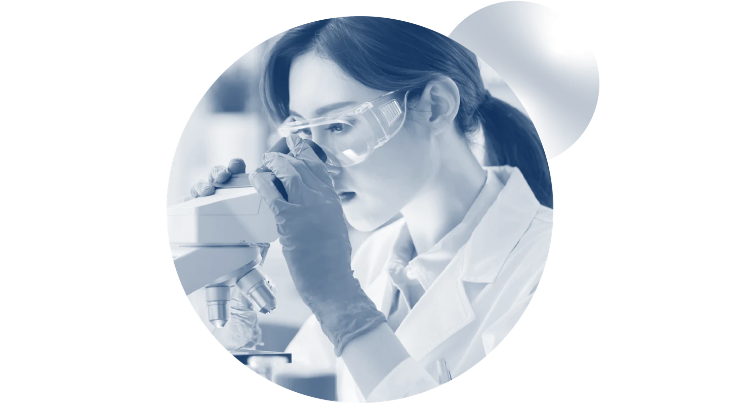 female scientist looking in microscope in circle frame