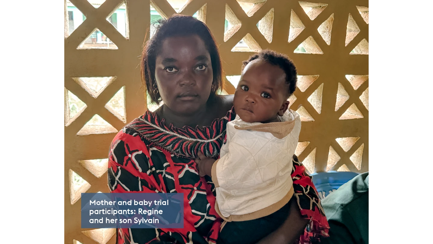 woman and her baby both looking at the camera