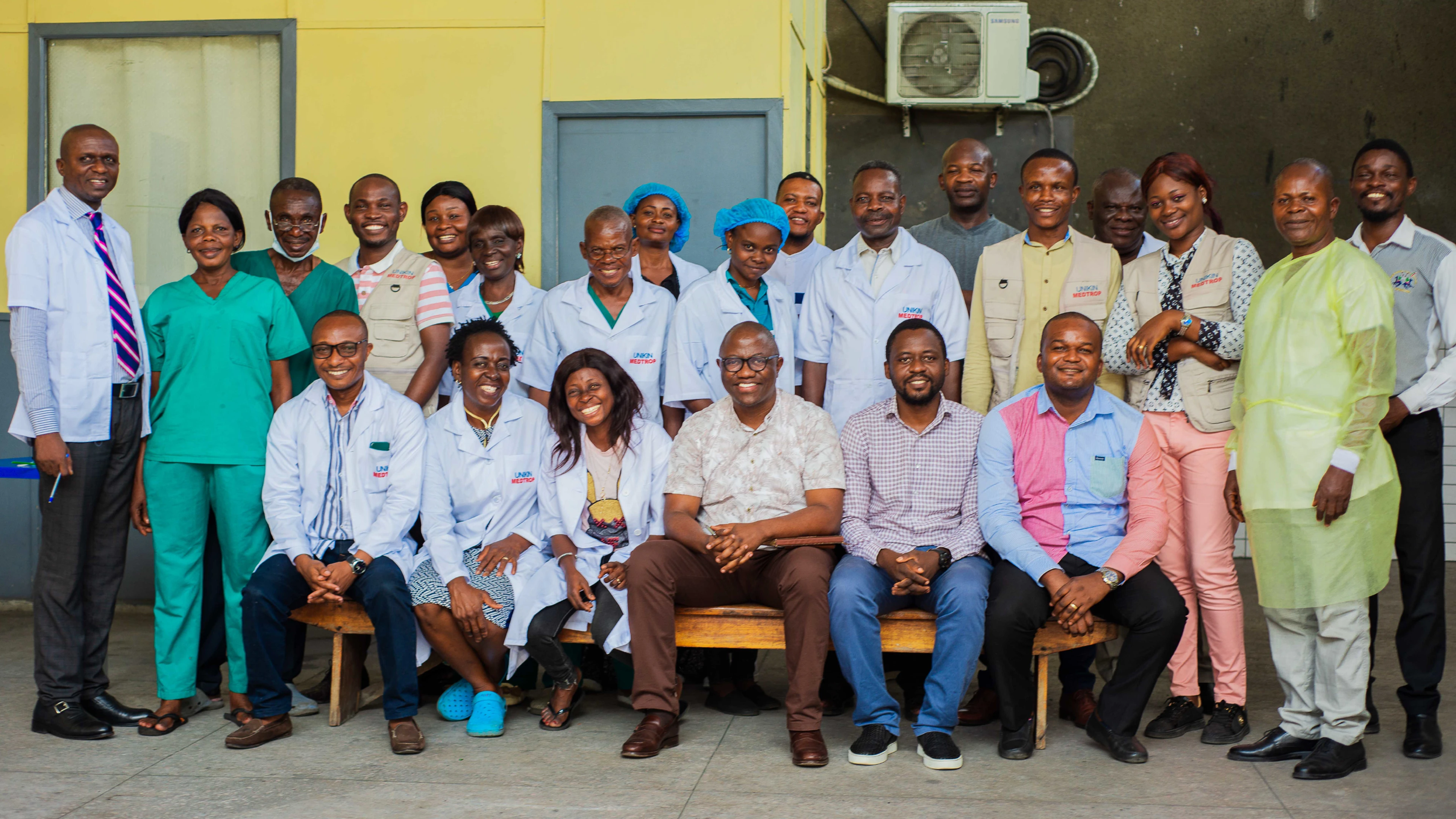group photo of Hypolite Mavoko's research team looking at the camera and smiling