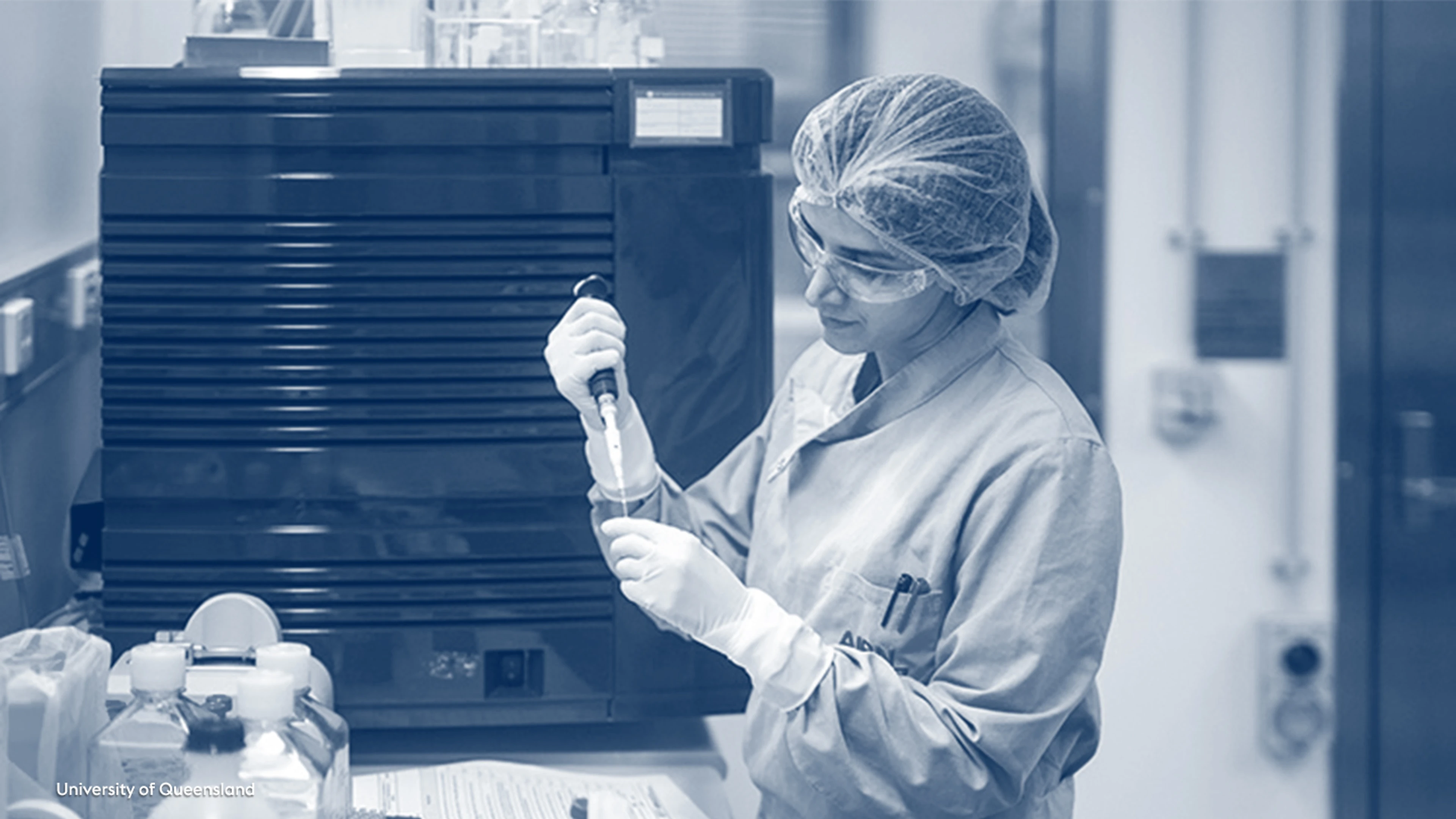 female researcher at University of Queensland holding pipette
